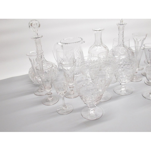 79 - Pair of glass decanters, another decanter (missing stopper), water jug and a collection of glasses (... 