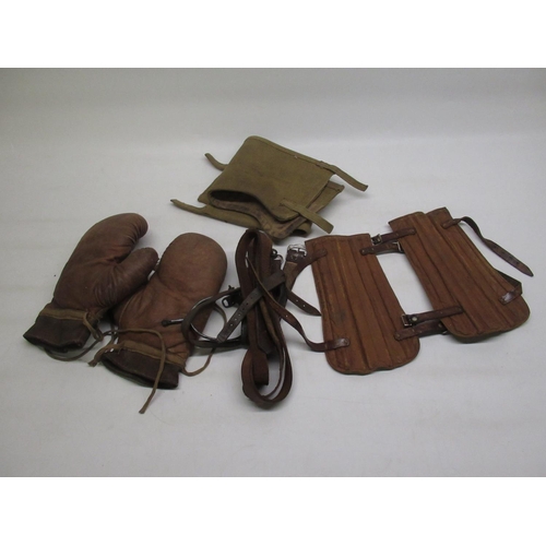 85 - Pair of early C20th boxing gloves, pair of early C20th archery arm braces, leather straps, etc.