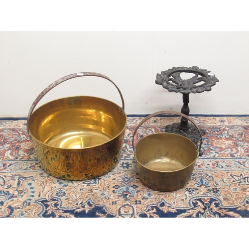 90 - Two brass jam pans and a small cast iron stand, H27cm