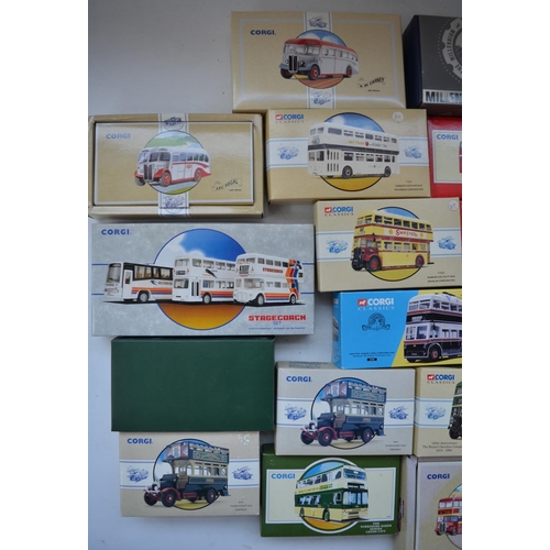 1513 - Twenty five Corgi diecast model buses, all mint/near mint with accessory bags etc