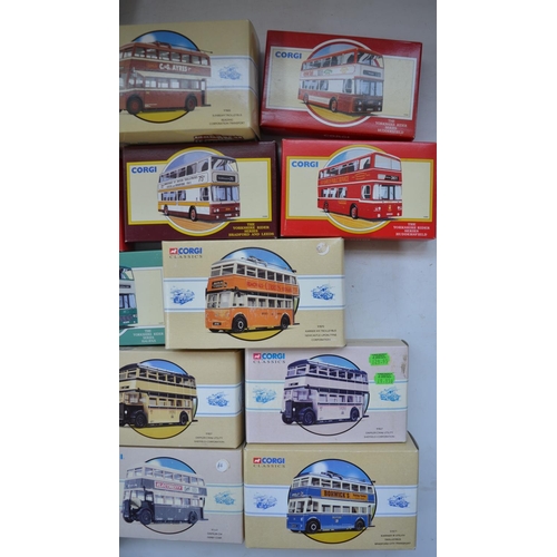 1513 - Twenty five Corgi diecast model buses, all mint/near mint with accessory bags etc