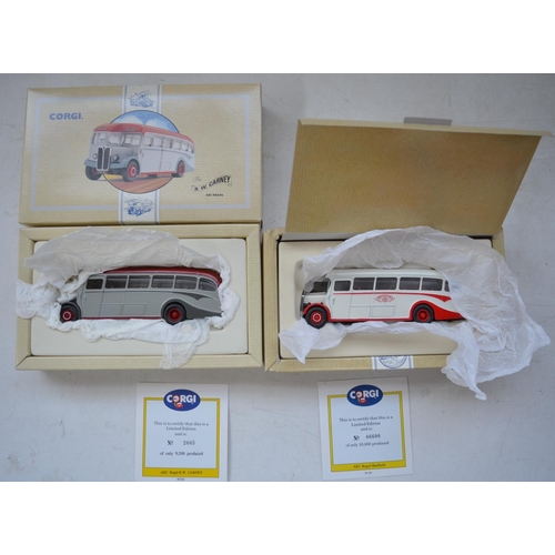 1513 - Twenty five Corgi diecast model buses, all mint/near mint with accessory bags etc