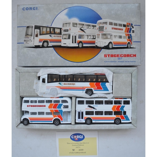 1513 - Twenty five Corgi diecast model buses, all mint/near mint with accessory bags etc