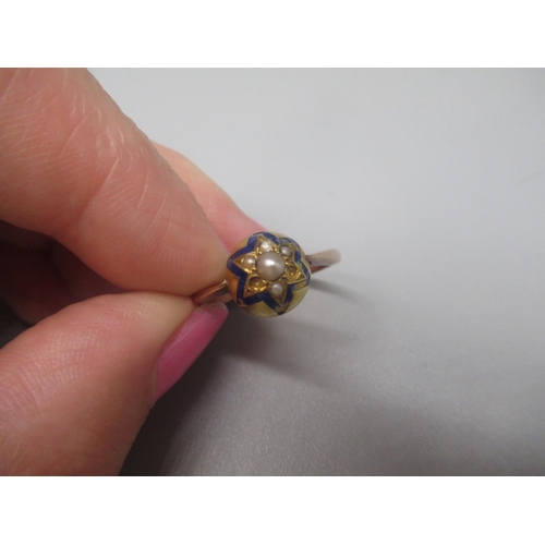 23 - Victorian yellow metal domed ring set with blue enamel star and seed pearls, size R1/2, 3.7g