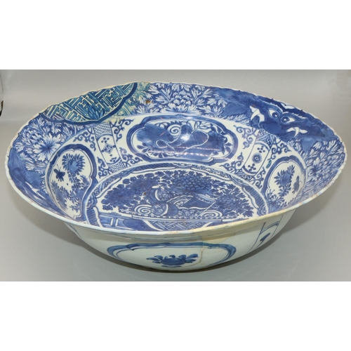 57 - Dom Joly Collection - Chinese porcelain circular bowl, decorated in blue and white with a vases in a... 