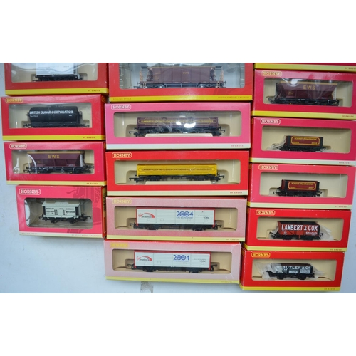 96 - Twenty one OO gauge goods wagons from Hornby to include hoppers, tankers, closed vans, plank wagons,... 