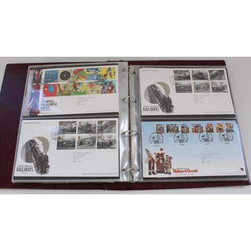 602 - Three folders of FDCs with some included Royal Mail Mint stamp presentation packs