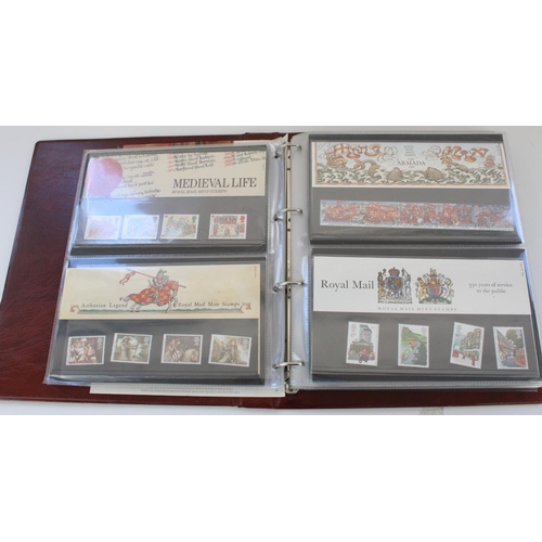 604 - Three folders of mainly Royal Mail Mint stamp presentation packs and some FDCs