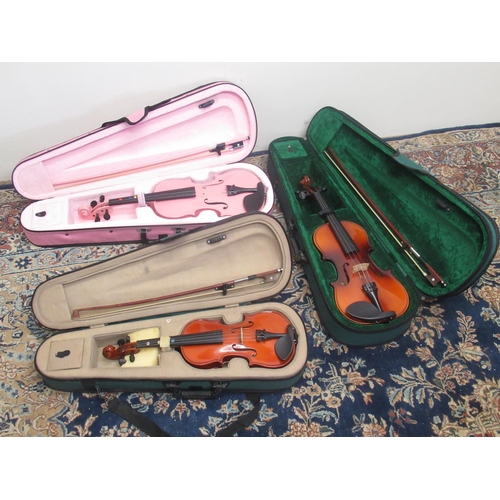 372 - Nine cased student violins