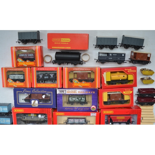 106 - Collection of OO gauge rolling stock, various manufacturers to include Hornby, Tri-Ang, Lima and Dap... 