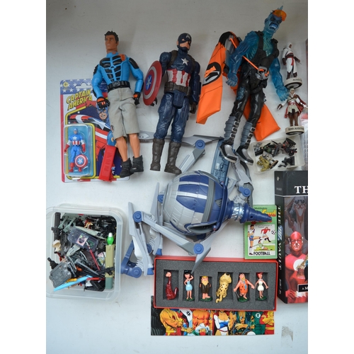 149 - Mixed lot to include super hero action figures, Flintstones and Madagascar figure sets, The DC Vault... 