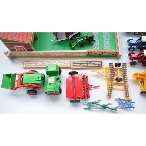 200 - Collection of farm toys to include farmyard layout, farm machinery and tractors, mostly Britains, an... 