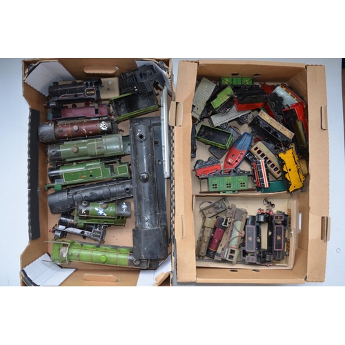 204 - Two boxes of damaged O gauge tin plate model trains and rolling stock including locomotive bodies in... 