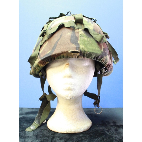 1087 - Modern British kevlar combat helmet with camouflage cover, liner and chinstrap