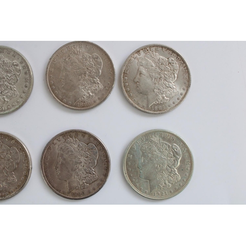 639 - Eight US silver Morgan dollars, dates 1881 (2), 1883, 1884, 1886, 1889, 1890 and 1921