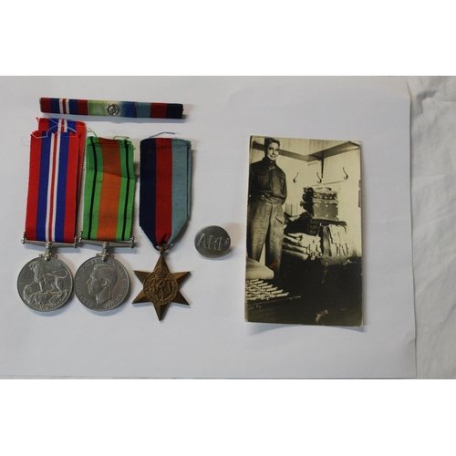 1075 - The War Medal 1939-45, Defence Medal, 1939-45 Star. A.R.P. Tunic button and Photo' of T. Shoesmith.