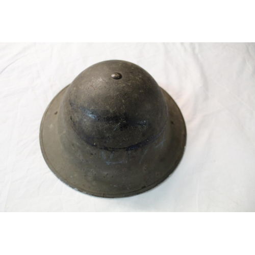 1083 - WW2 Bodie helmet with liner and chinstrap dated 1940.