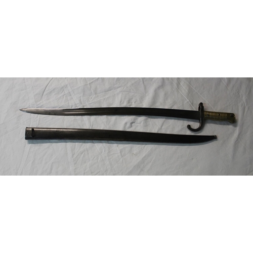 1092 - French sword bayonet for Chassepot rifle dated 1866, with cast brass grip, iron cross guard and stac... 