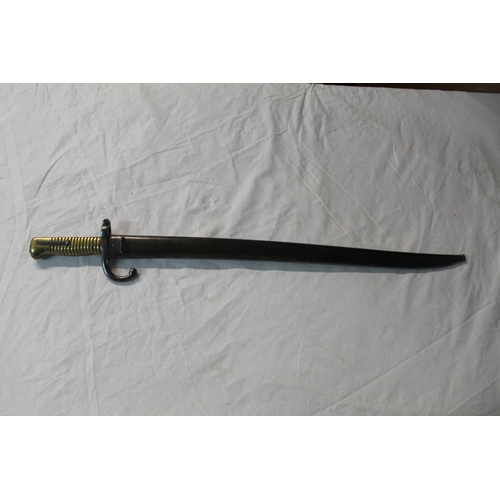 1092 - French sword bayonet for Chassepot rifle dated 1866, with cast brass grip, iron cross guard and stac... 