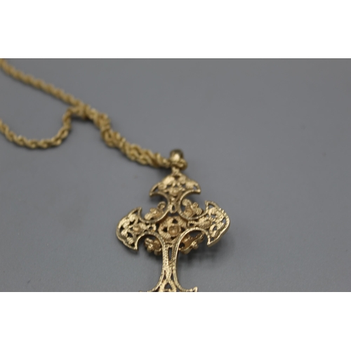 767 - 9ct yellow gold ornate cross pendant on 9ct yellow gold rope twist chain, L62cm, both stamped 375, 8... 