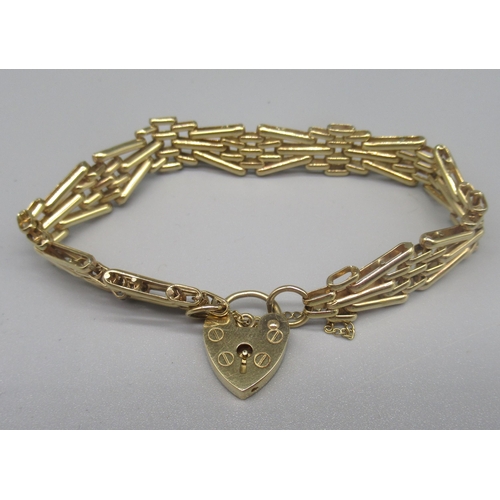 765 - 9ct yellow gold three gate bracelet with heart padlock clasp and safety chain, stamped 375, 18.2g