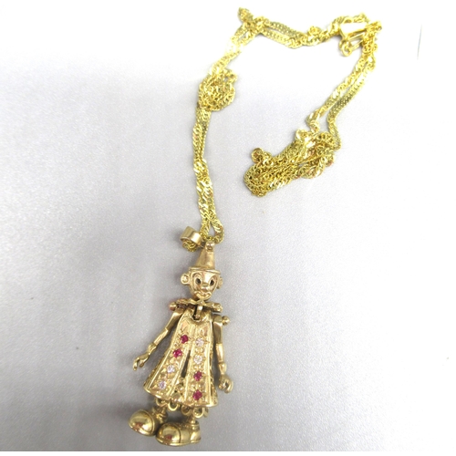 766 - 9ct yellow gold articulated clown pendant set with rubies and clear stones, on 9ct yellow gold chain... 