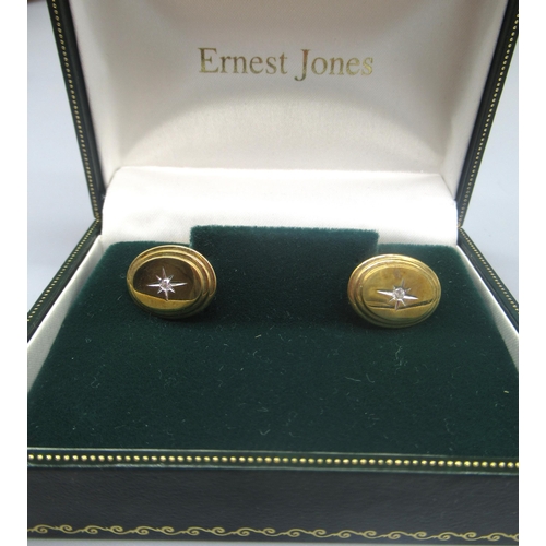 768 - Pair of 9ct yellow gold cufflinks with star set diamond to the centre of each, stamped 375, gross 6.... 