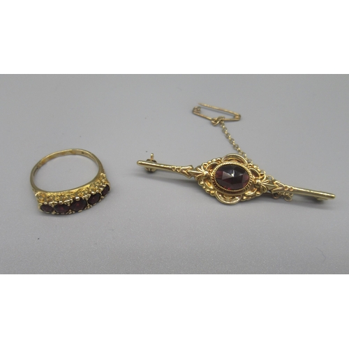 781 - 9ct yellow gold Edwardian style brooch set with dark red glass, and a 9ct yellow gold ring set with ... 