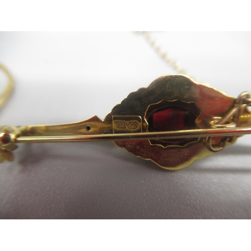 781 - 9ct yellow gold Edwardian style brooch set with dark red glass, and a 9ct yellow gold ring set with ... 