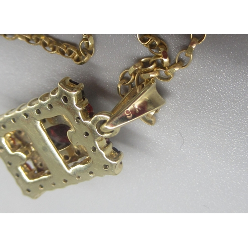 782 - 9ct yellow gold square pendant set with red glass, stamped 9k, on 9ct yellow gold chain, stamped  L5... 