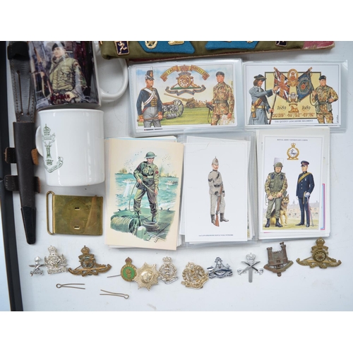 220 - Collection of military ephemera incl. postcards, cap badges, Gurkhas etc, a Russian cap dated 1976 w... 