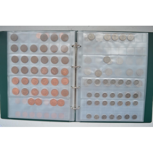 65 - Folder containing decimal and pre-decimal British coins to include collectable 50 pence pieces, poun... 