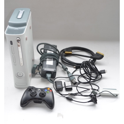 66 - White Xbox 360, 60GB hard drive with 1x controller, Microsoft wireless networking adapter, scart and... 