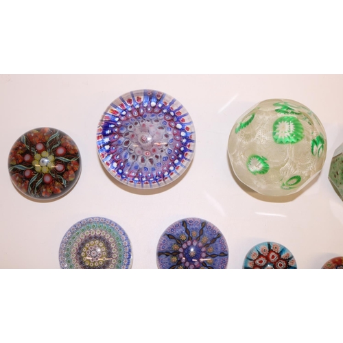 117 - Collection of mid-late C20th glass paperweights, predominantly millefiori, including one with a foot... 