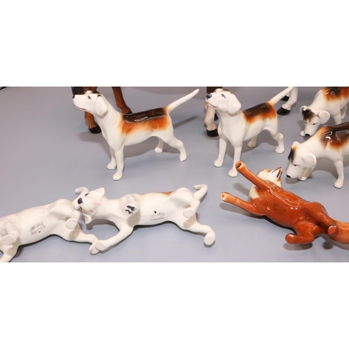 75 - Beswick hunting figures: standing huntsman on bay horse, huntswoman on dapple grey horse, fox, and s... 