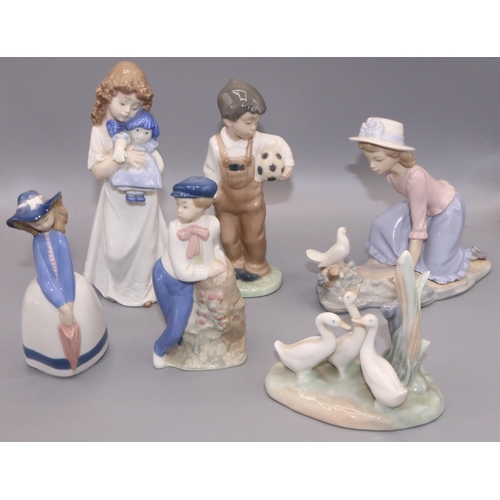 707 - Four Nao Figures - Wanna Play 01008 H19cm, Group of Ducks 0006  H12cm, Girl Holding a Doll H21cm, on... 