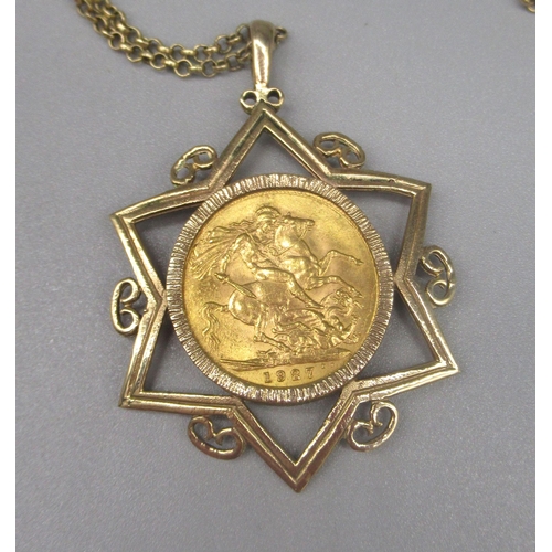6 - Geo.V 1927 sovereign mounted in yellow metal star pendant mount, on 9ct yellow gold belcher chain, s... 
