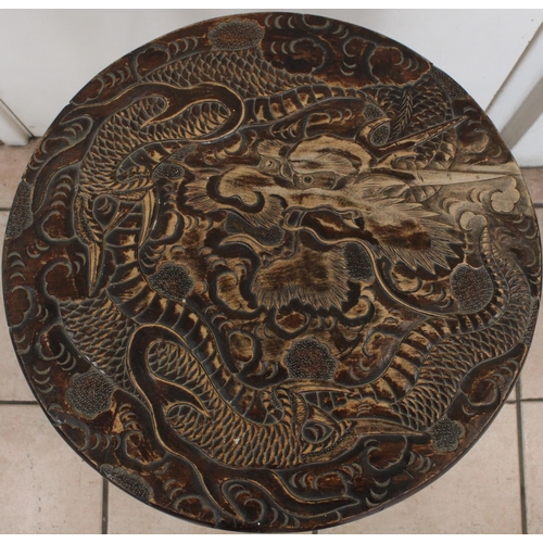 154 - Early C20th Oriental two tier occasional table, with carved dragon and cloud design, H62cm