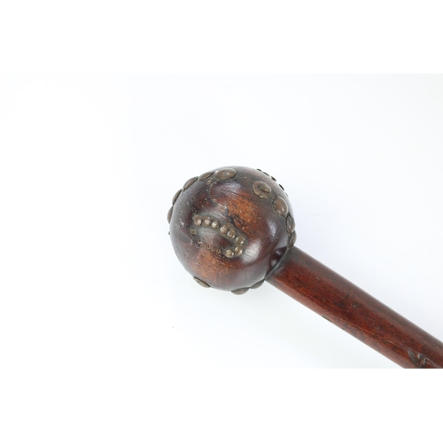 177 - African hardwood knobkerrie, globular head set with metal studs, H72cm