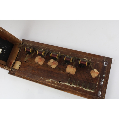 178 - Early C20th electric servants bell board of five windows in mahogany frame and backboard, W44cm