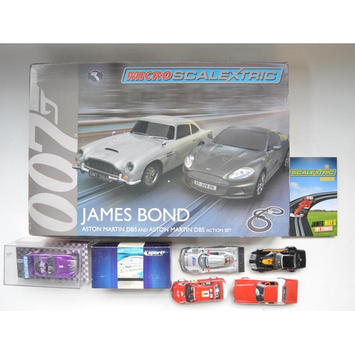 506 - Boxed 1/64 scale Micro Scalextric G1122 James Bond Aston Martin DB5 and DBS Action set, excellent li... 