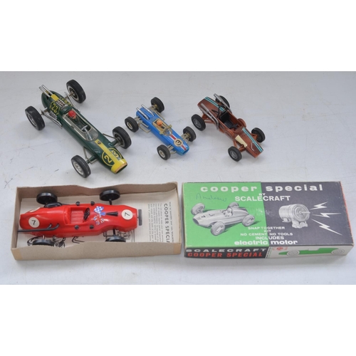 507 - Three vintage plastic race car models to include a Formula 1 Lotus friction powered race car No23 by... 