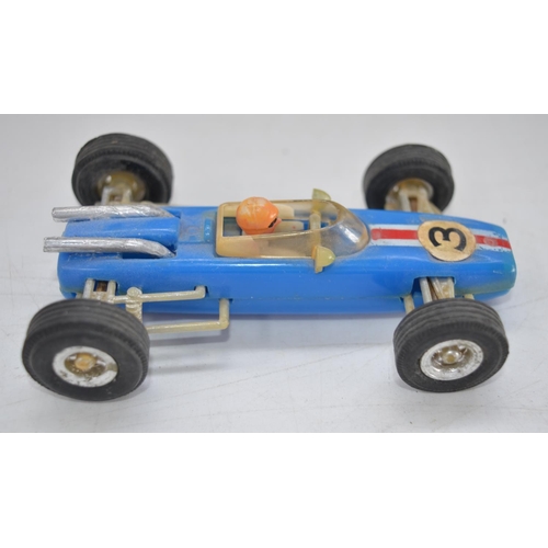 507 - Three vintage plastic race car models to include a Formula 1 Lotus friction powered race car No23 by... 