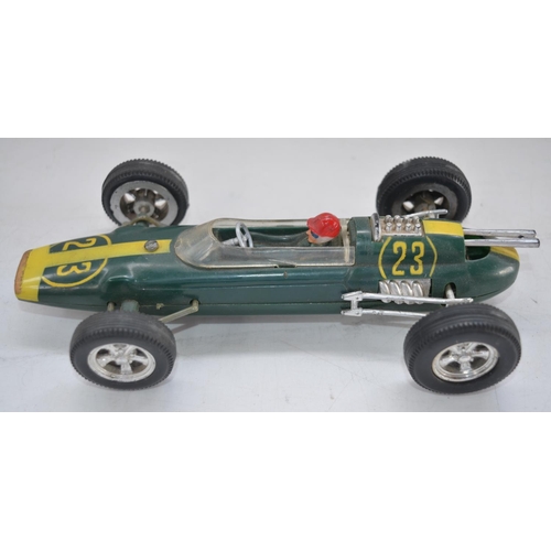 507 - Three vintage plastic race car models to include a Formula 1 Lotus friction powered race car No23 by... 