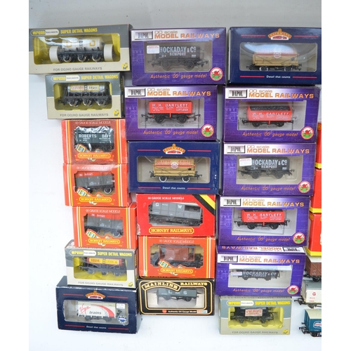 518 - Collection of mostly boxed OO gauge railway wagons and passenger coaches incl. Hornby, Dapol, Bachma... 