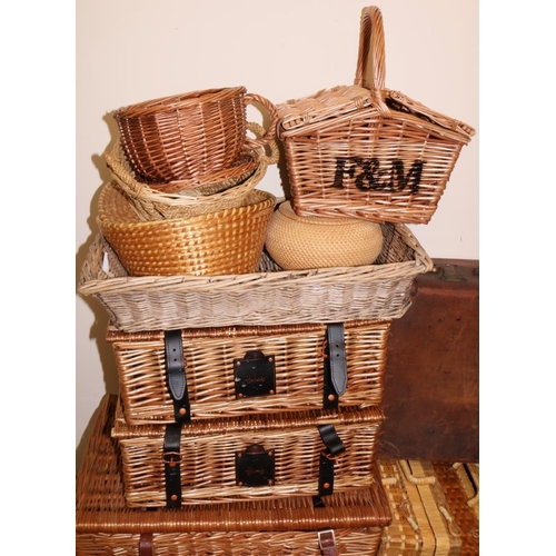 123 - Group of wicker and straw baskets and hampers, including a Fortnum & Mason hamper and two Harrods ha... 