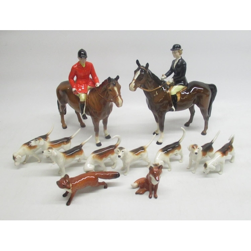 316 - Beswick Hunting group comprising huntsman on horseback, huntswoman on horseback (a/f), 8 hounds and ... 