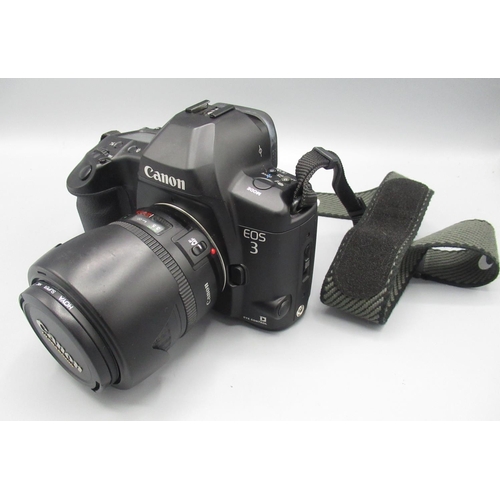 498 - Canon EOS 3 with 28-105mm Ultrasonic lens and a  photographers carry bag cont. flashes, lens cleaner... 