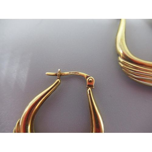 21 - Pair of 9ct yellow gold shaped hoops with grooved detail, stamped 375, a 9ct gold brooch set with se... 
