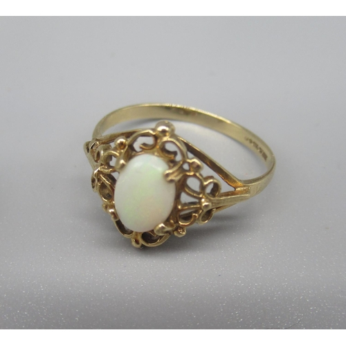23 - 9ct yellow gold cameo ring, size L, a 9ct gold ring set with cabochon oval, size J1/2,  and a 9ct go... 